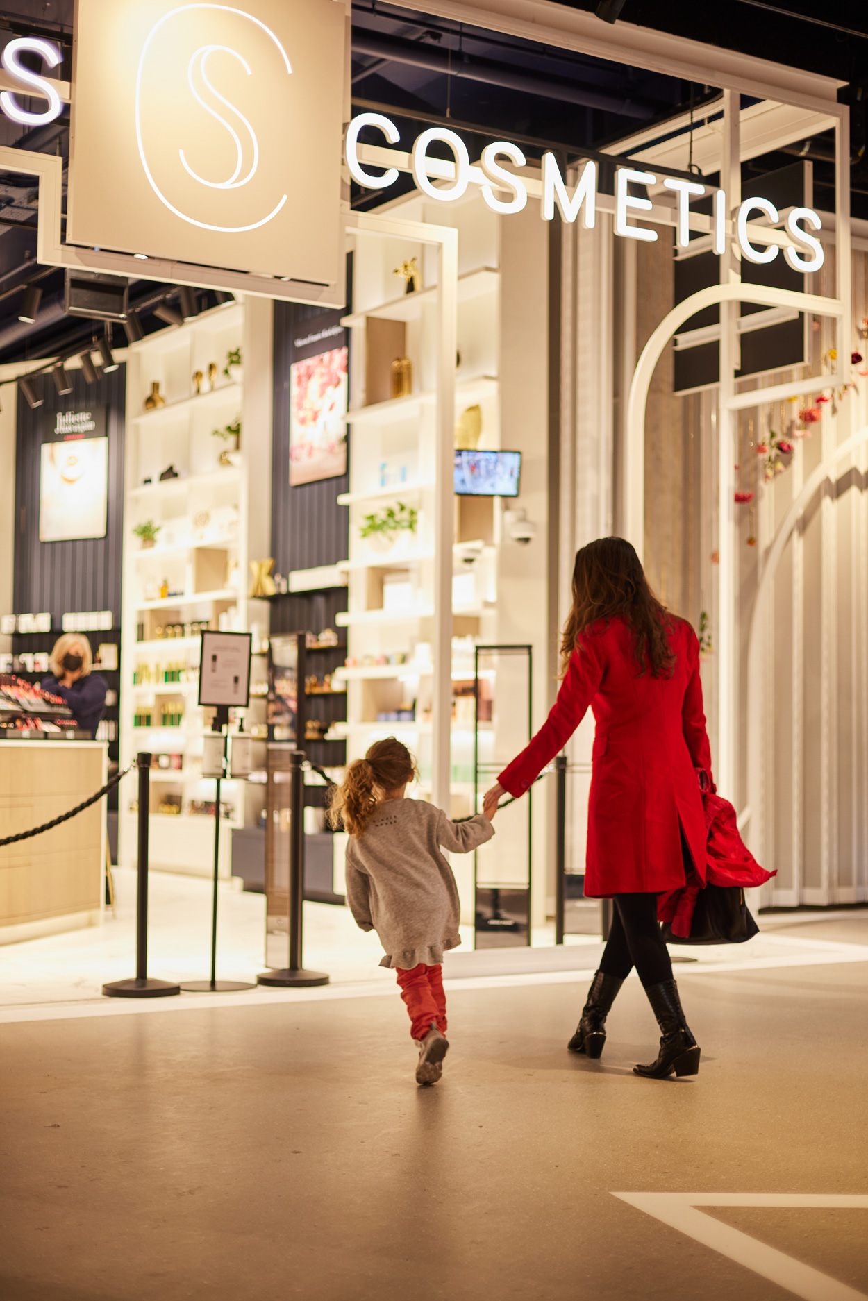 Mother and child outside Skins beauty store